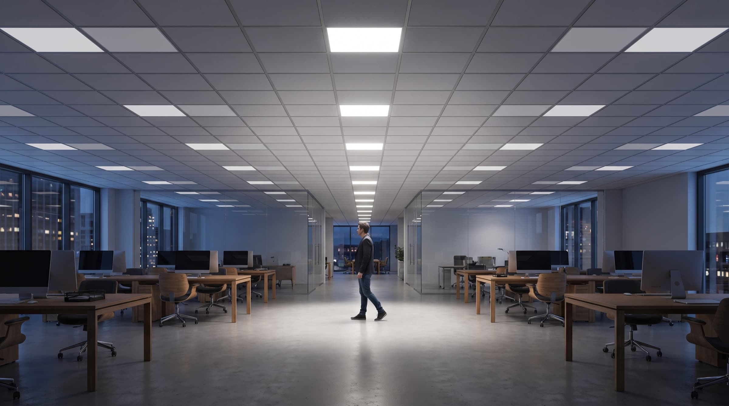 Großraumbüro mit LED-Panels und Schwarmlicht — eine helle Zone folgt einer Person über die Fläche, während entfernte Panels auf einen Ruhepegel abdimmen